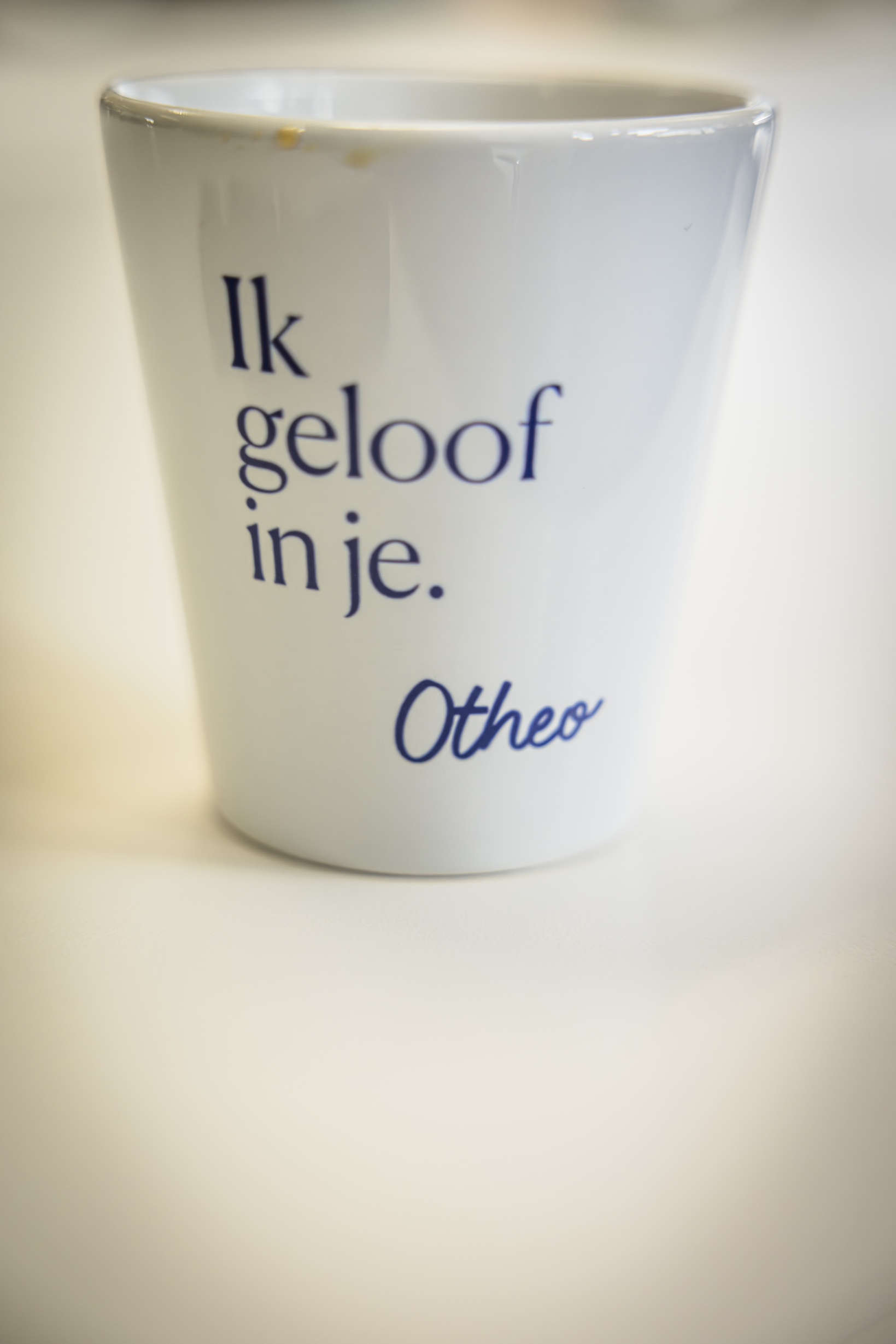 Kopje koffie met opschrift 'Ik geloof in je', Otheo.