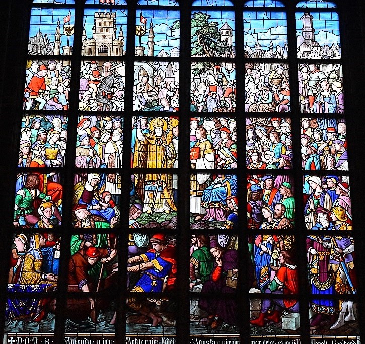 Het negotische glasraam 'Sint-Amandus komt in Antwerpen het christelijke geloof verkondigen' uit 1872 (van Edouard Didron) in de Sacramentskapel van Antwerpen schept een heel idealistisch beeld van de zevende-eeuwse missioneringsactiviteit